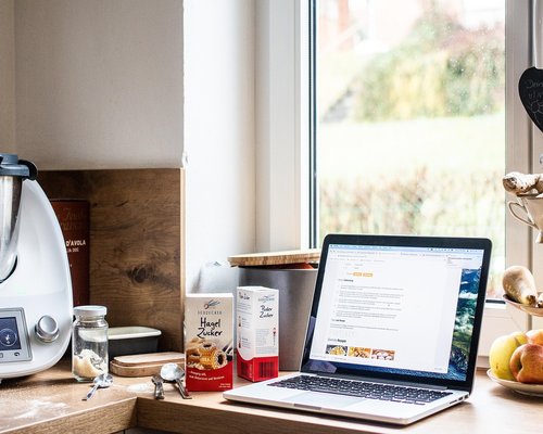 person working at home with healthy meal