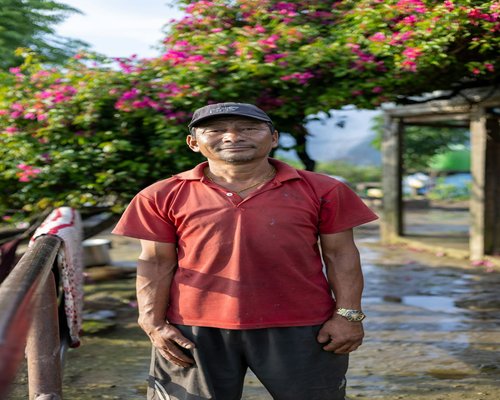 asian man smiling in natural light